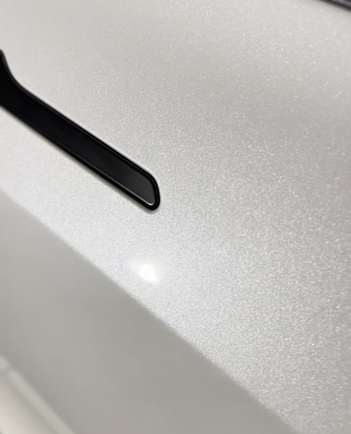 Close-up of silver metallic paint finish